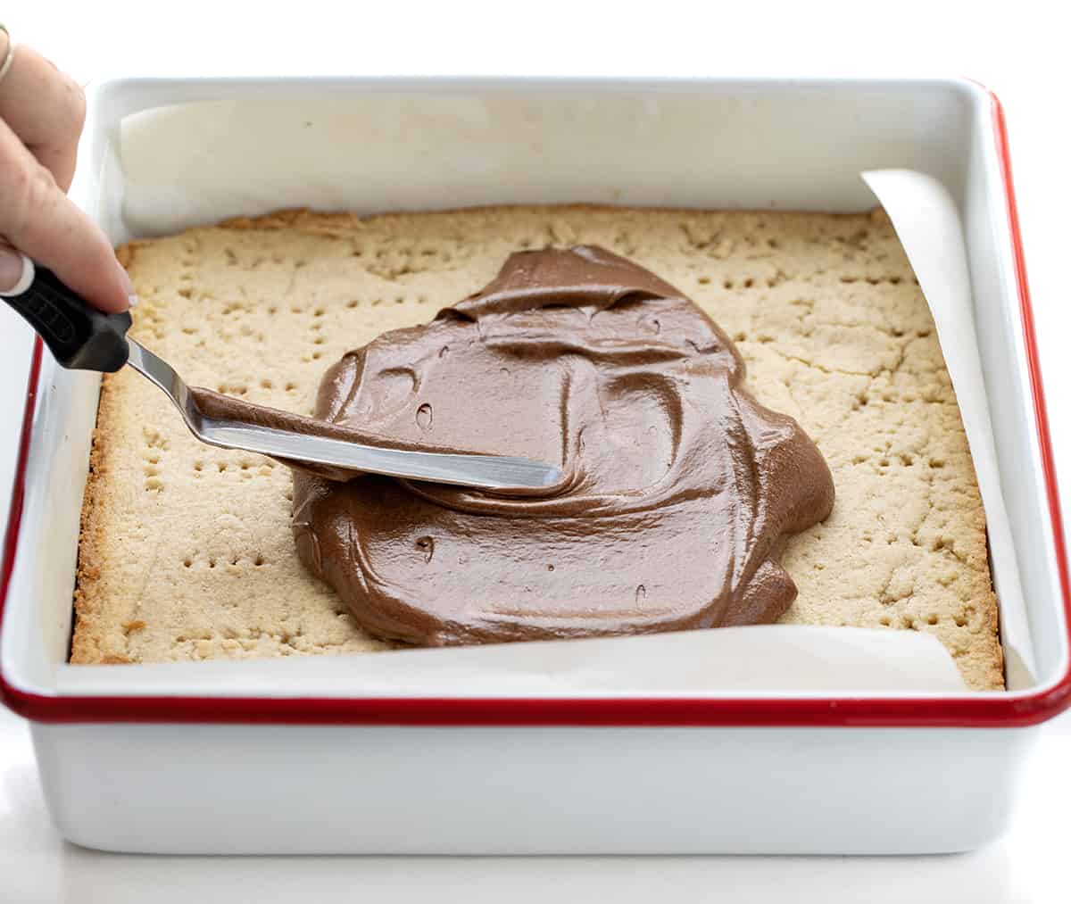 Spreading Chocolate Over Cinnamon Shortbread Bars.